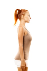 Young woman with position defect and ideal bearing on white background